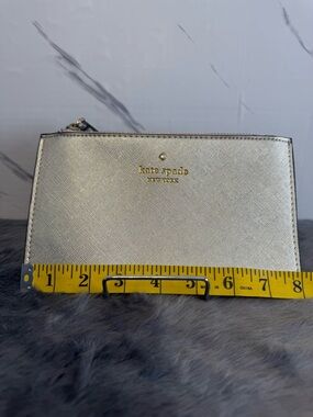 kate spade Metallic Silver Textured Zip Wallet with Gold Logo